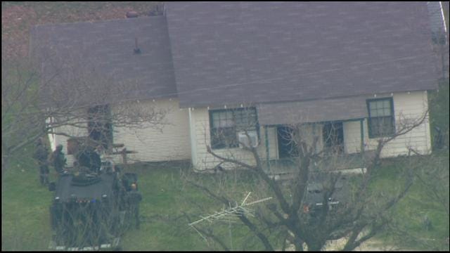 WEB EXTRA: Authorities Crash Into House With Homicide Suspect