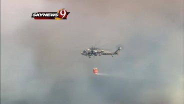 WEB EXTRA: SkyNews9 Captures Helicopter Dropping Water On Grassfire Near Harrah