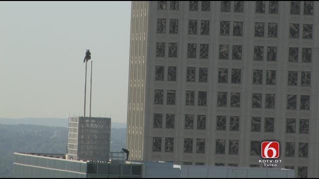 WEB EXTRA: Worker Fixes City Hall Flag Pole