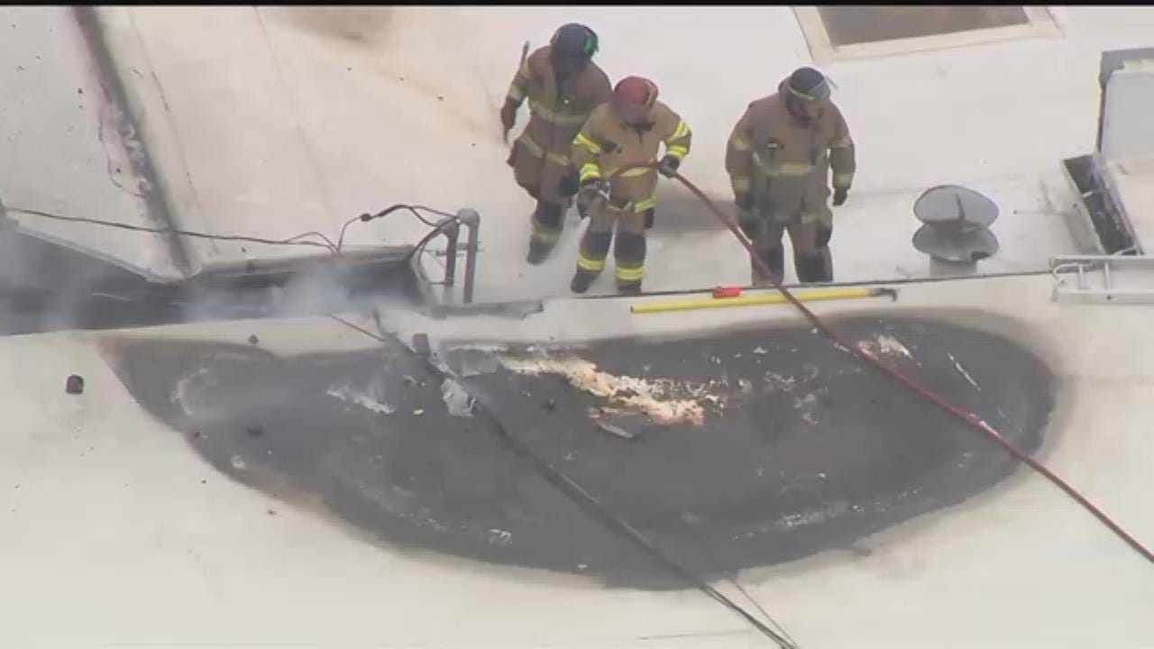 Watch: Tulsa Firefighters On Roof Of Burning Building