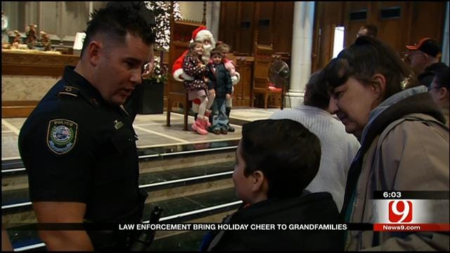 Law Enforcement Officers Bring Christmas Cheer To Metro Kids