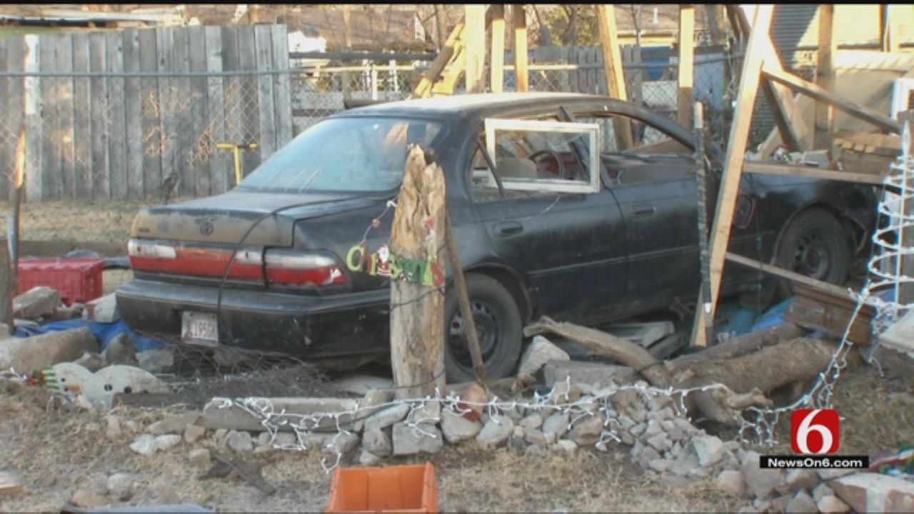 Driver Plows Through Tulsa Yard, Ditches Car