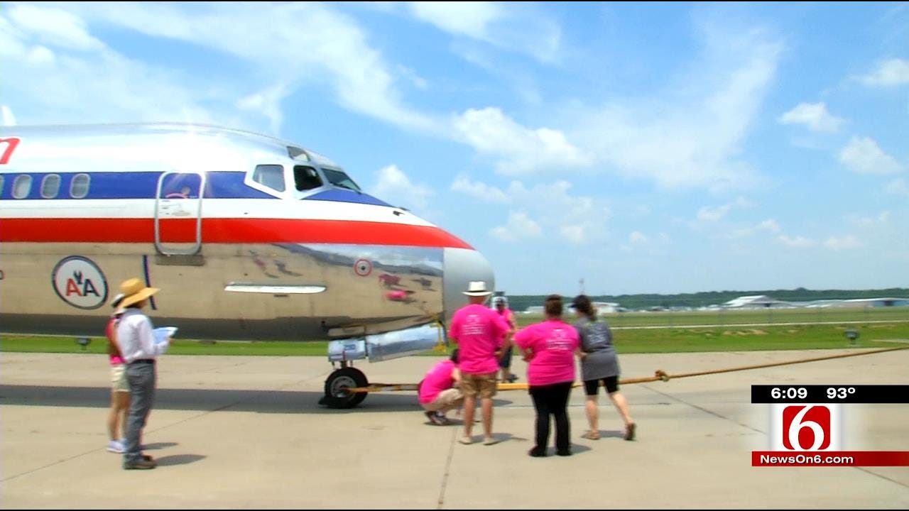 Teams Pull A Plane For Green Country Charity