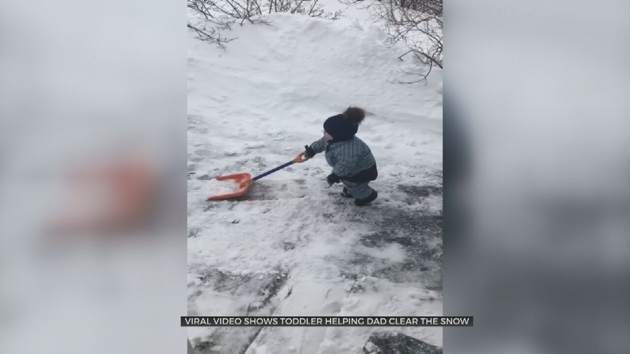 WATCH: Boy Tries To Help Clear Snow, Takes A Break