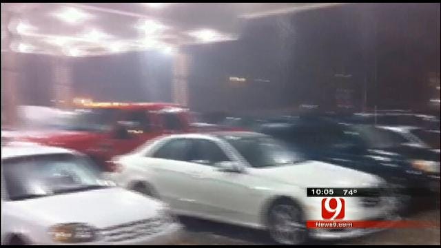 Cars Crowd For Shelter Under Gas Station Awning