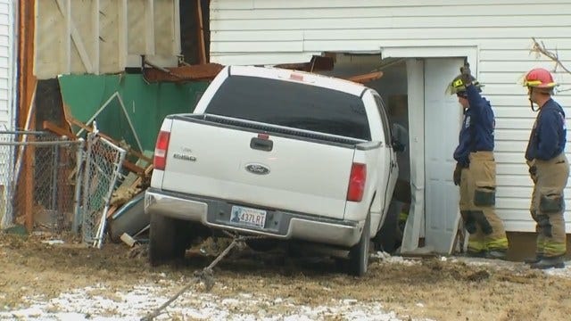 WEB EXTRA: Video Of Pickup Truck Being Pulled From West Tulsa Home
