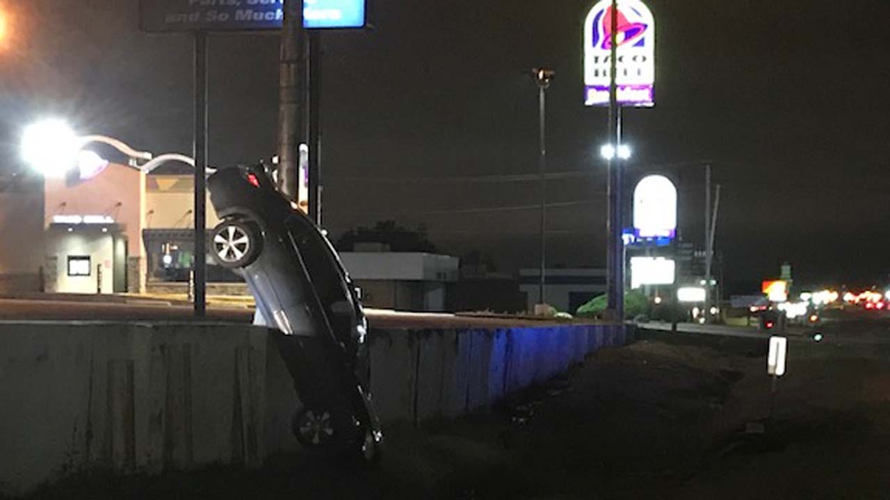 WATCH: Car Hangs Off Raised Tulsa Parking Lot