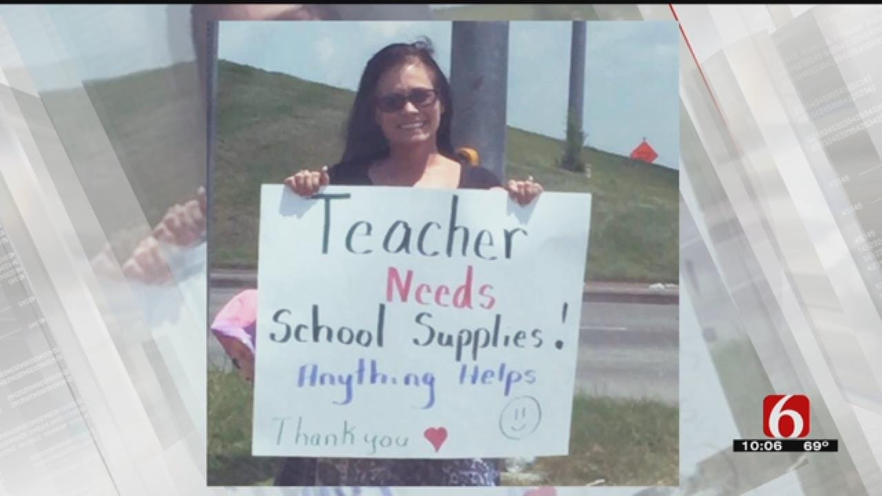 Panhandling Teacher Gives Back