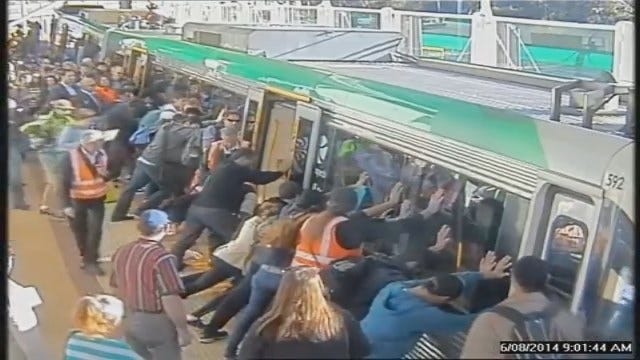Commuters Tip Train Car To Help Rescue Trapped Man