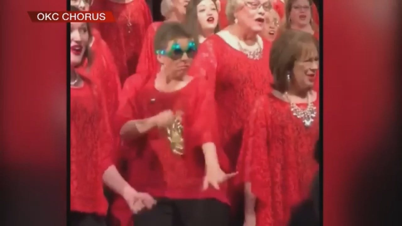 Woman Jingles Bells During OK City Chorus Concert