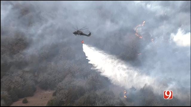 WEB EXTRA: Black Hawks Air Drop Water On Logan County Wild Fires