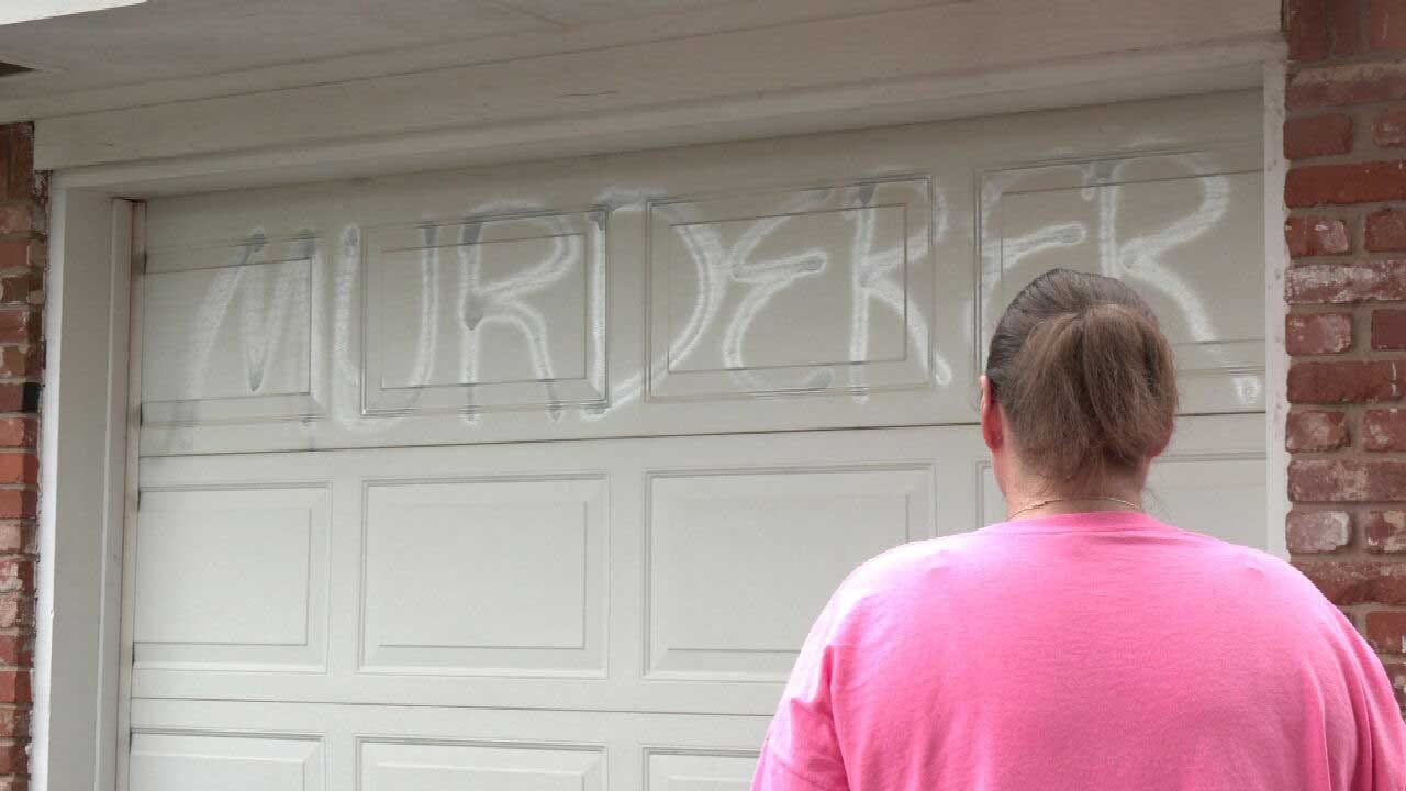 Del City Couple Fears For Safety After Catching Landlord Spray Painting 'Murderer' On Their Garage Door
