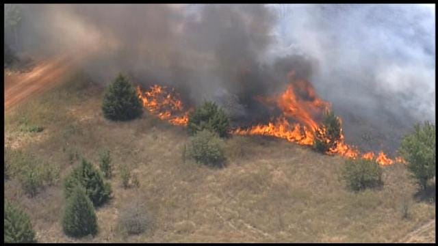 Grass Fire Burns Near Structures In Norman