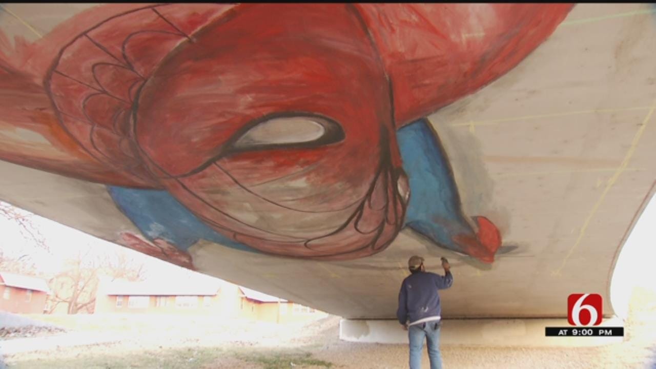 Tulsa Artist Paints Giant Spiderman Mural On Riverside Bridge