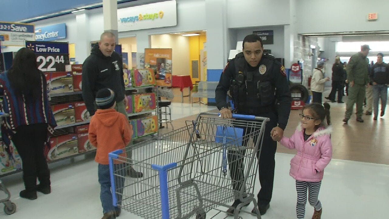 Police Officers Bring Some Christmas Cheer During 'Shop With A Cop' Event