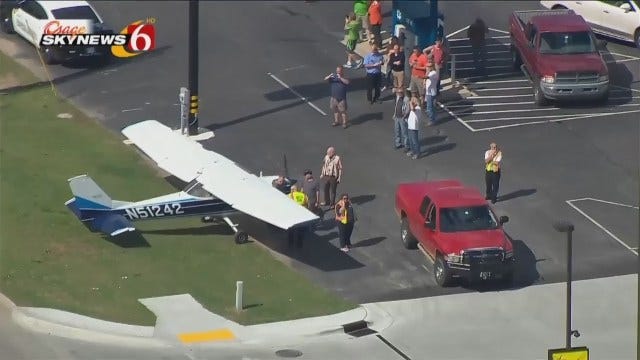 Aerials: Plane Lands On Busy Bixby Road