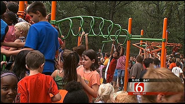 Volunteers Band Together To Refurbish Westside YMCA Playground