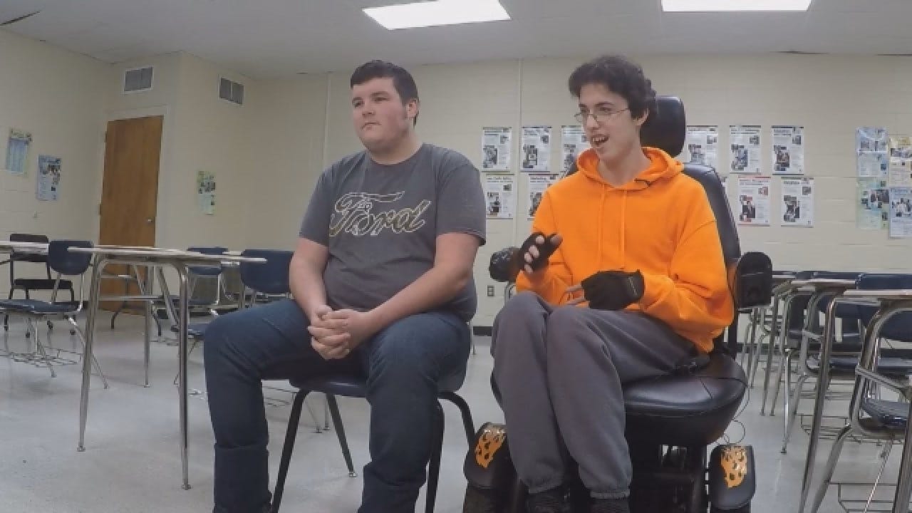 Teenage Boy Buys Friend Electric Wheelchair