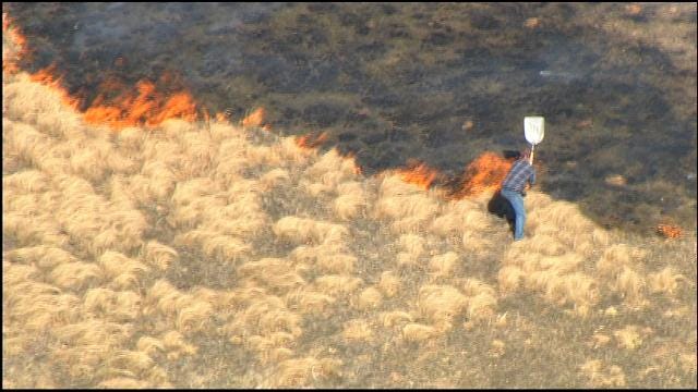 Man Tries To Beat Back Harrah Grass Fire With Shovel
