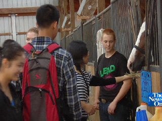 Jenks FFA Hosts Chinese Exchange Students in Day at the Farm