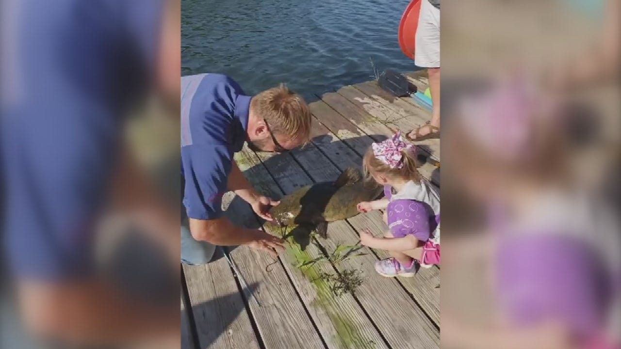 WATCH: Little Girl Catches A Fish That's Bigger Than Her