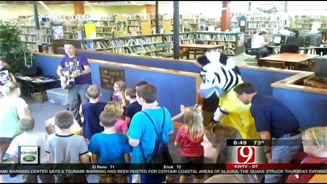 Jed Castles Cuts A Rug At The Weatherford Public Library