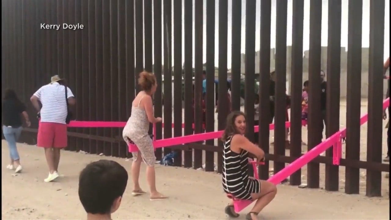 Artist Installs Seesaws At Border Wall So Children In The U.S.,Mexico Can Play Together