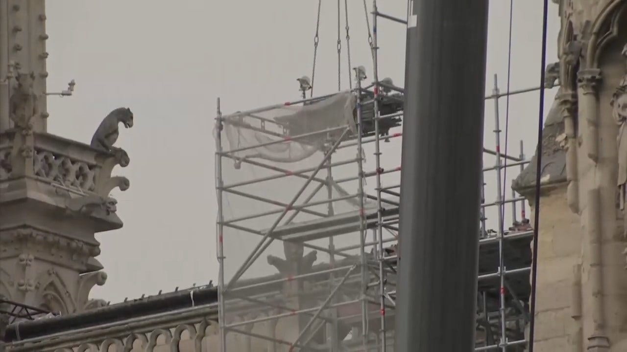 Workers Install Temporary Tarps To Save Notre Dame From Potential Rain Damage