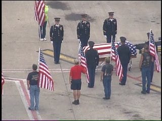 SKYNEWS 6: Soldier's Casket Unloaded From Airplane By Military Honor Guard