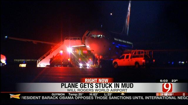 Denver-Bound Plane Stuck In Mud At Will Rogers Airport