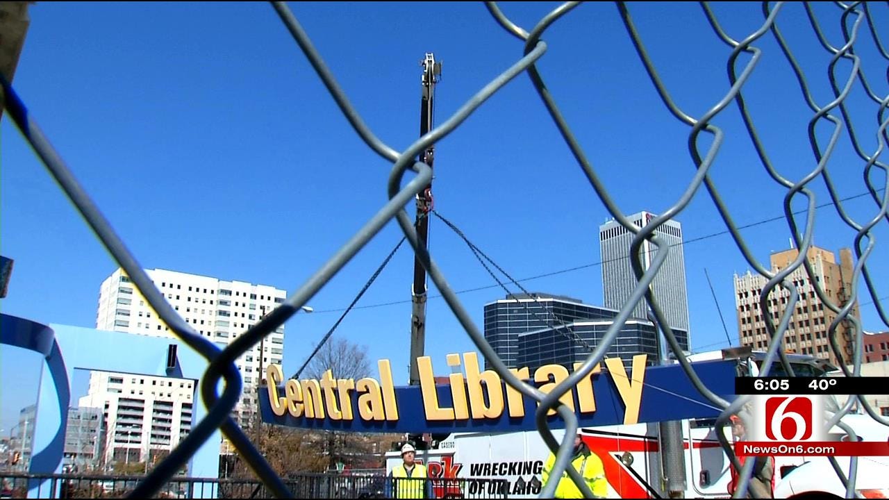 Crews Remove Old Central Library Sign