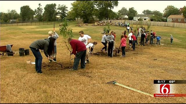 Holland Hall Students Plant Trees At Tulsa Housing Complex